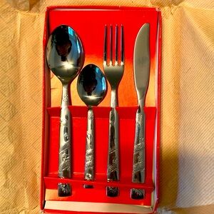 New 4 piece STAINLESS 555 flatware set